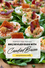 A picture of cooked bbq deviled eggs with candied bacon on top, sitting on a serving board with arugula underneath